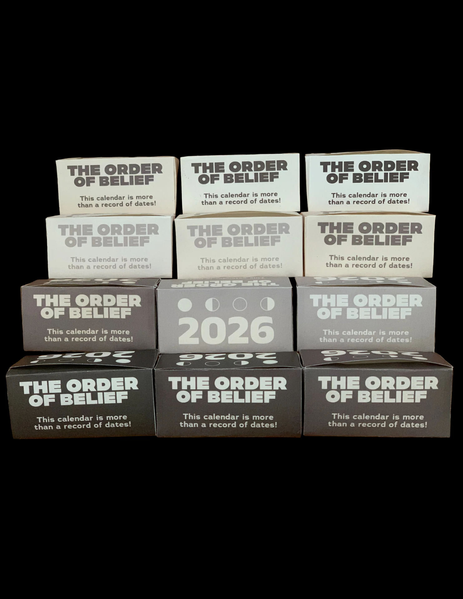 The Order of Belief - Packaging tonal ladder - bone to charcoal across the edition